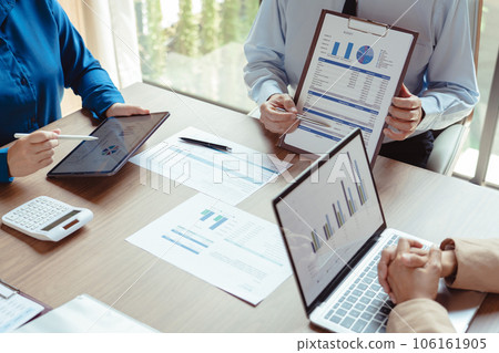 Businessman explains finance data to business colleague and coworking about marketing of business 106161905