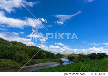 Midsummer sky and river flowing country scenery material Midsummer sky and river flowing country scenery material 106163201