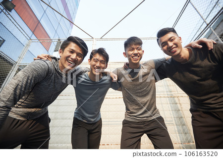 team of four young asian adult athletes having fun outdoors 106163520