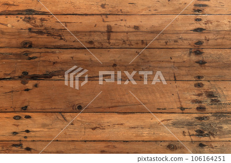 Old wooden flooring made of rough uncolored planks Old wooden flooring made of rough uncolored planks 106164251