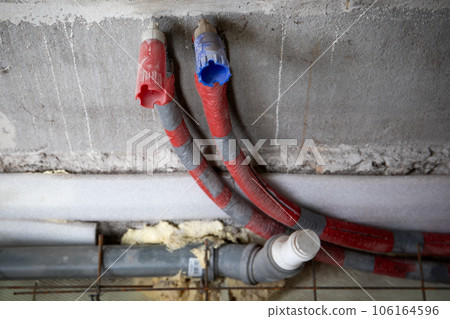 Sewer pipe, hot and cold water pipes. Plumbing and construction 106164596