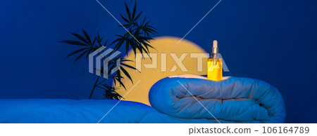 Night bedroom, bottle of CBD oil, Hemp branch on blanket podium in moonlight 106164789
