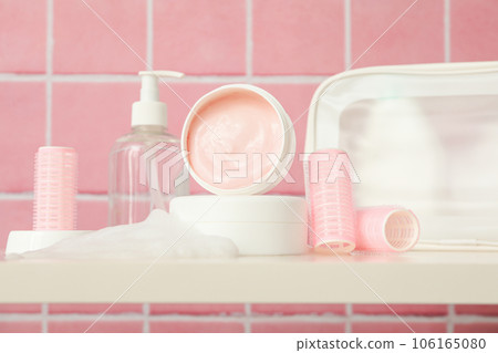A shelf in the bathroom with care products. A shelf in the bathroom with care products. 106165080