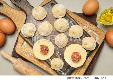 Cooking home food concept with raw dumplings Cooking home food concept with raw dumplings 106165120