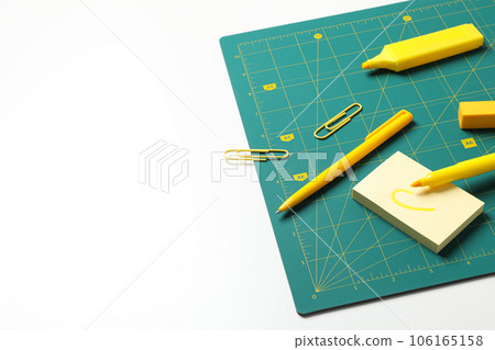 Patchwork accessories concept on white background, cutting mat 106165158