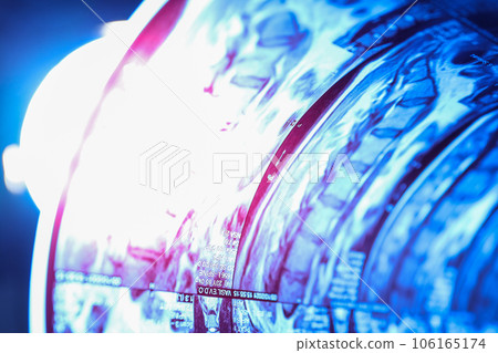 MRI or magnetic resonance imaging of the human spine is illuminated by a lamp. Close up 106165174