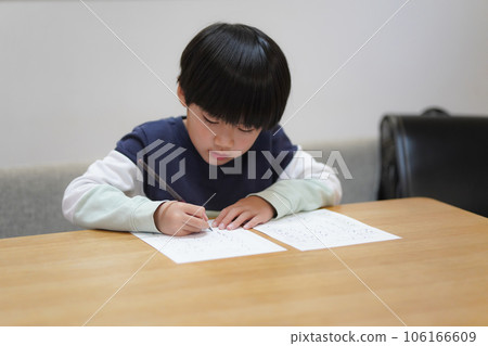 boy practicing calligraphy 106166609