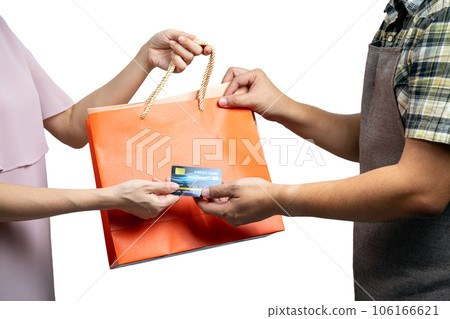 Asian Consumer Making a Purchase with Credit Card and grap Shopping Bag from sale staff 106166621