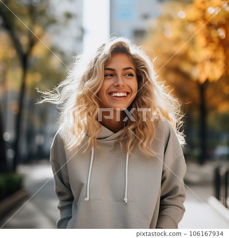 Beautiful young lady dressed in gray sweater, commercial sweatshirt mock-up, smiling blonde woman standing in the street Beautiful young lady dressed in gray sweater, commercial sweatshirt mock-up, smiling blonde woman standing in the street 106167934