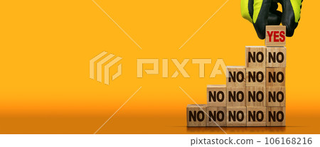 Stack of Wooden Blocks with Text Yes or No on Orange Background Stack of Wooden Blocks with Text Yes or No on Orange Background 106168216