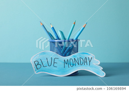 Text Blue Monday and blue pencils in stand on blue background Text Blue Monday and blue pencils in stand on blue background 106169894
