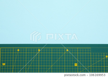 Patchwork accessories concept on a turquoise background, mat cutting Patchwork accessories concept on a turquoise background, mat cutting 106169953