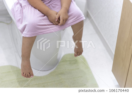 Image of a girl doing toilet training 106170440