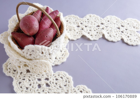 Various kinds of sweet potatoes in a basket Warm image 106170889