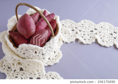 Various kinds of sweet potatoes in a basket Warm image 106170890