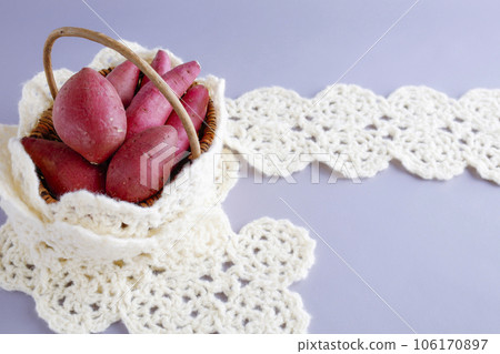 Various kinds of sweet potatoes in a basket Warm image 106170897