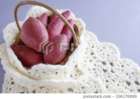 Various kinds of sweet potatoes in a basket Warm image 106170899