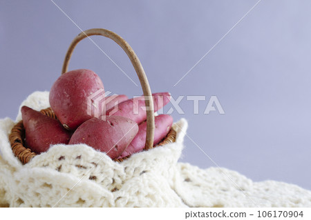 Various kinds of sweet potatoes in a basket Warm image 106170904