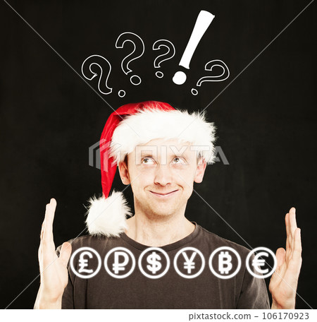 Man in Santa Hat with currency icons in his Hands. Sale Concept 106170923