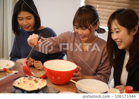 Woman making takoyaki Woman making takoyaki 106171044