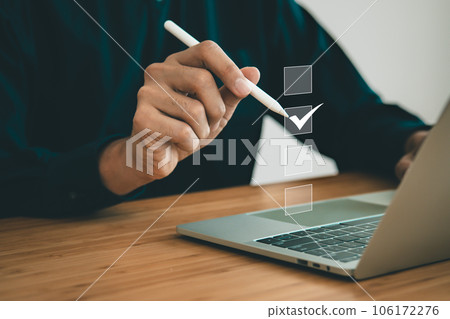 Businessman check mark on the screen of checklist box. business checklist and digital document concept. Businessman check mark on the screen of checklist box. business checklist and digital document concept. 106172276