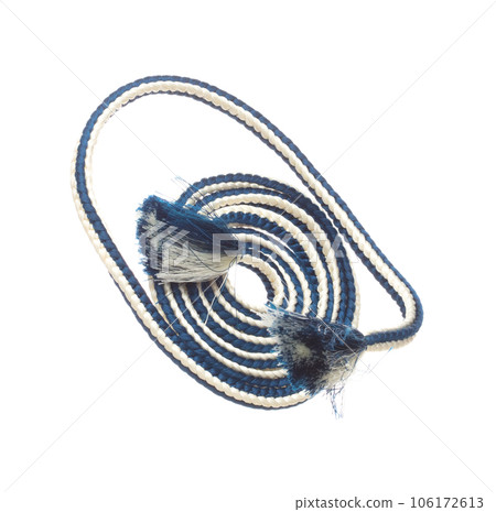 String rope obi Japanese Traditional Komono equipment fly in air with curve. String rope obi Japanese Traditional Komono fabric is beautiful clothes for ceremony event. White background isolated 106172613