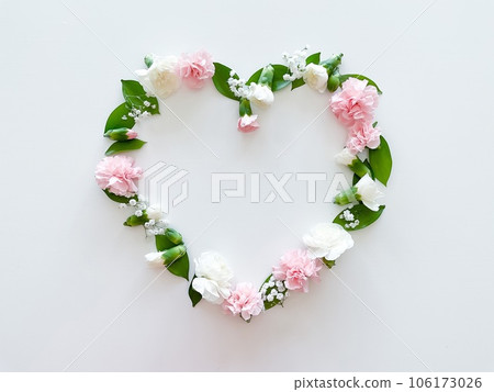 Frame in form of heart from pink, white carnations 106173026