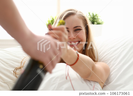 woman take bottle of wine unhealthy way of life 106173061