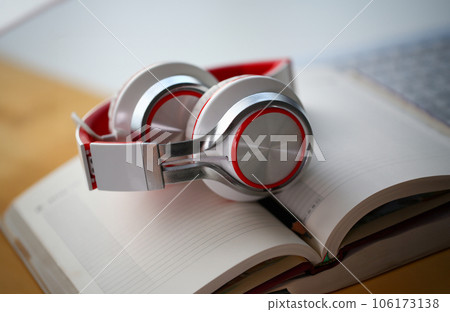 Headphones are on the table in the office 106173138
