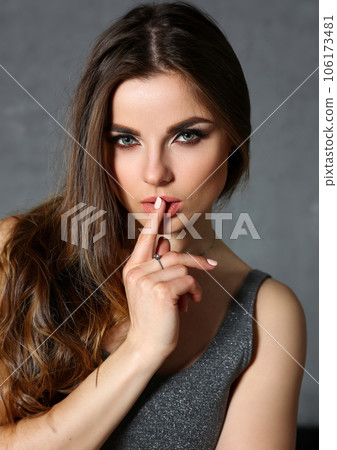 Beautiful european woman portrait on gray background Beautiful european woman portrait on gray background 106173481
