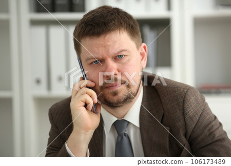 Handsome smiling businessman talk cellphone Handsome smiling businessman talk cellphone 106173489