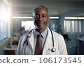 Male adult afroamerican doctor portrait against medical clinic 106173545