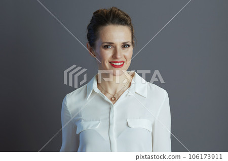 happy 40 years old business owner woman against grey happy 40 years old business owner woman against grey 106173911