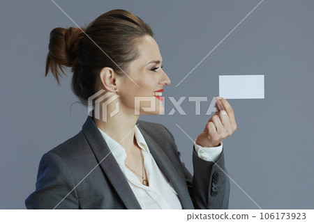 happy trendy business owner woman isolated on gray 106173923