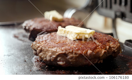 Cooking beef patties for burgers on electric grill. Cooking at home, kitchen appliance, healthy nutrition, hamburger ingredients. 106176180