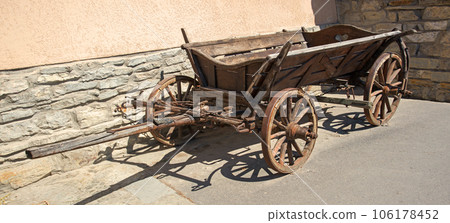 Old wooden cart on the square Old wooden cart on the square 106178452