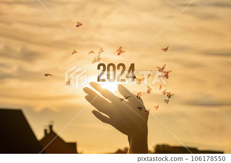 Hand supports the New Year 2024. Hand supports the New Year 2024. 106178550