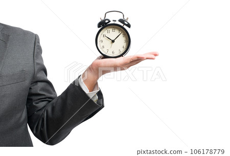 businessman hold a alarmclock to set the deadline 106178779