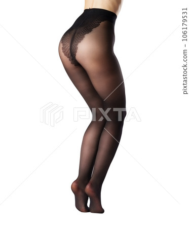 Legs of a woman in black capron tights on white background Legs of a woman in black capron tights on white background 106179531