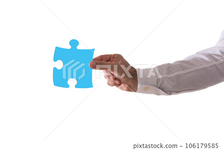 Isolated  businessman holds a piace of puzzle. Concept teamwork, partnership, integration 106179585