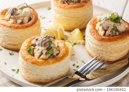 chicken mushrooms Vol au vent closeup on the plate on the wooden table. Horizontal 106180402