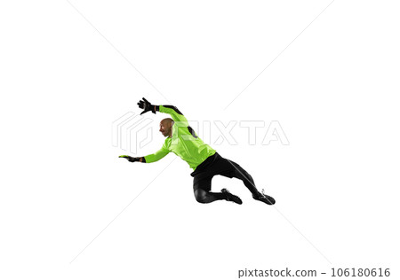 Soccer goalkeeper jumps to defend his team during a football game Soccer goalkeeper jumps to defend his team during a football game 106180616