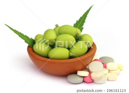 Medicinal neem fruits with tablets Medicinal neem fruits with tablets 106181123
