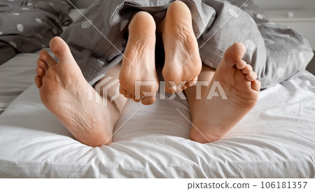 Loving couple s feet having sex an intimate  Stock Photo  