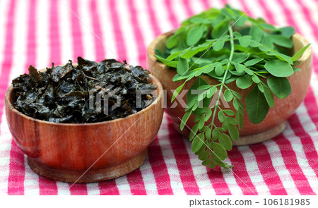 Fried and green moringa leaves 106181985