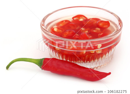 Red chili peppers in a transparent bowl 106182275