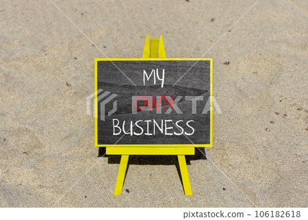 My own business symbol. Concept words My own business on beautiful black chalk blackboard. Beautiful sand background. Business motivational my own business concept. Copy space. 106182618