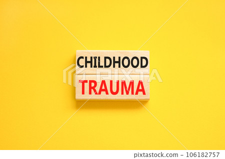 Childhood trauma symbol. Concept words Childhood trauma on beautiful wooden blocks. Beautiful yellow table yellow background. Business psychology childhood trauma concept. Copy space. 106182757