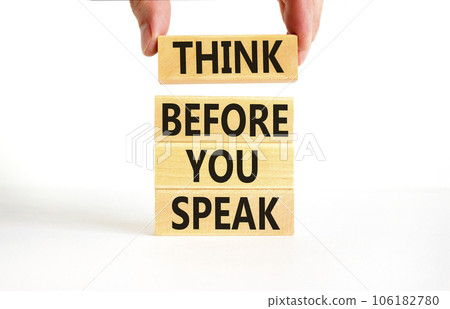 Think before you speak symbol. Concept words Think before you speak on wooden cubes. Beautiful white table white background. Businessman hand. Business think before you speak concept. Copy space. 106182780