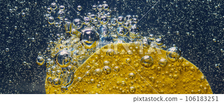 Deep fried potato chips under golden oil water. Frying rounded potatoes chip with hot boiling oil bubbles. Fast food and snack. Underwater cooking oily french fries or potatos chips in oils background Deep fried potato chips under golden oil water. Frying rounded potatoes chip with hot boiling oil bubbles. Fast food and snack. Underwater cooking oily french fries or potatos chips in oils background 106183251